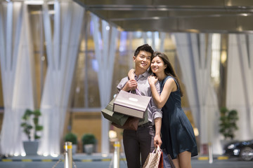 Happy young couple shopping