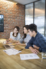Business people having meeting in board room