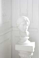 Obraz premium head still life in white interior, classic antique sculpture object for drawing in art school