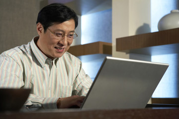 Businessman Typing On Laptop