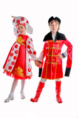 young boy and girl in medieval carnival costume, red caftan, cocked hat, tricorn.red and white fluffy skirt