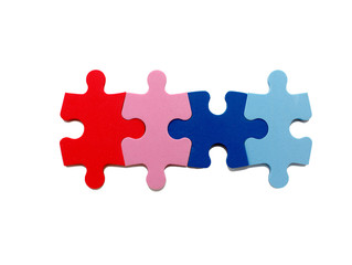 Fototapeta premium concept of open marriage. Four puzzle pieces of different colors symbolize an open relationship in marriage, sexual relations with different partners. isolated on white background