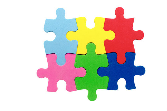 concept of teamwork. unity of six multicolored puzzle pieces symbolizes the partnership, cooperation and teamwork. Isolated on white background