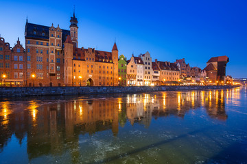 Naklejka na ściany i meble The old town of Gdansk at frozen Motlawa river, Poland