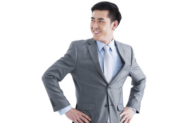 Cheerful businessman with hands on hip