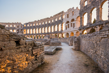 Inside of Ancient Roman Amphitheater in Pula, Croatia, Famous Travel Destination, in Sunny Summer Evening