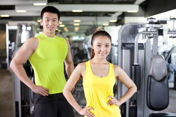 Young Man and Woman Together At Gym