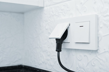 Electric plug in a socket © tashka2000