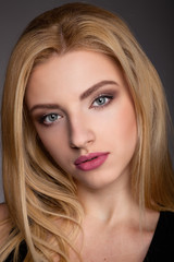 Portrait of a Beautiful Blonde Woman Model black background studio - Stock Image