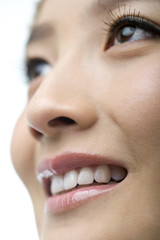 Close-up of a young woman looking up