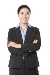 Businesswoman standing with arms crossed