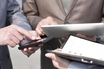 Business persons with digital tablet and mobile phone