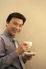 Young Man Holding Coffee Cup