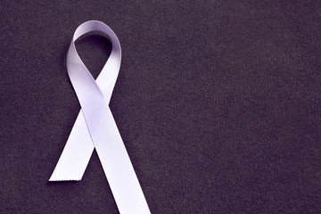 Lavender color ribbon, symbolising awareness for all cancers. February 4th, world cancer day.