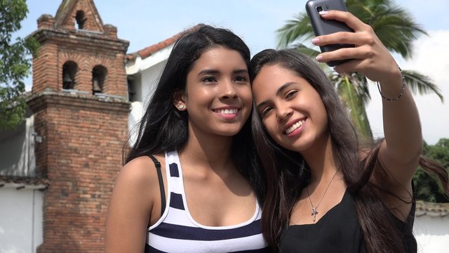 Teen Tourists Taking Selfie at Church