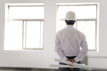 Contractor thinking at construction site