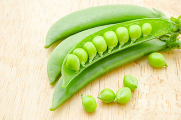 Green peas on wooden.