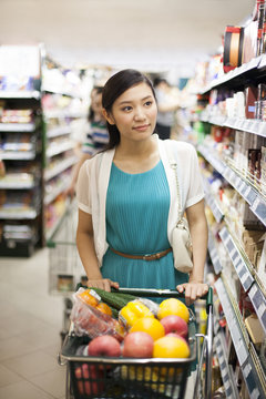 Young woman shopping in supermarket