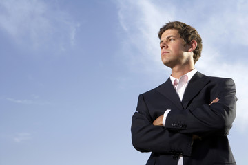 Man Standing In Field, Looking Into The Distance