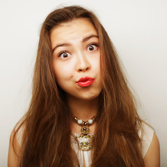 Beautiful young surprised woman.