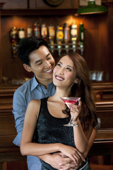 Couple Enjoying Cocktails Together