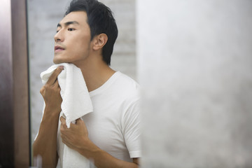 Young man shaving