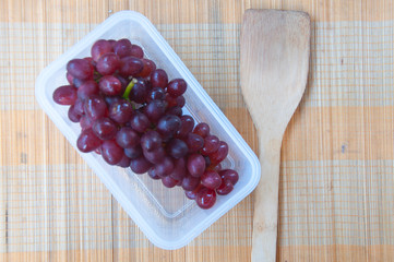 Red grape berries in white box