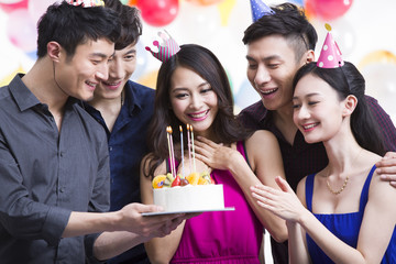 Young adults having a birthday party