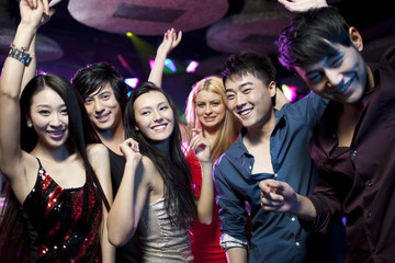 Stylish young people dancing in nightclub