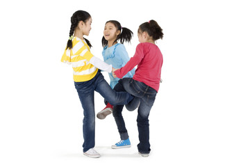 Fototapeta premium A group of girls playing a leg wrapping game