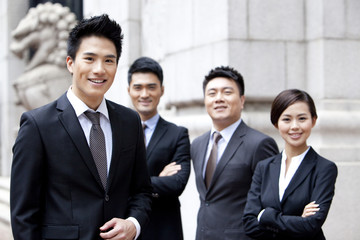 Portrait of confident business team outside a building, Hong Kong