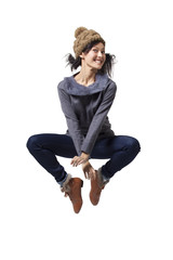 Young woman jumping in mid-air