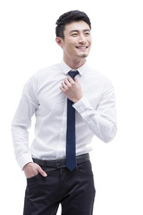 Fashionable businessman adjusting neckline