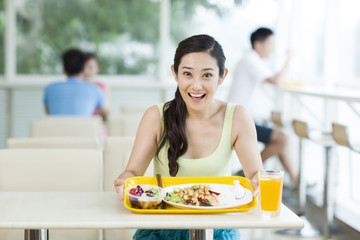 Young woman having a meal in restaurant