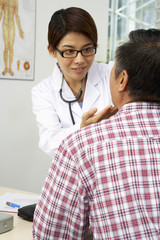 Doctor Checking Man's Throat