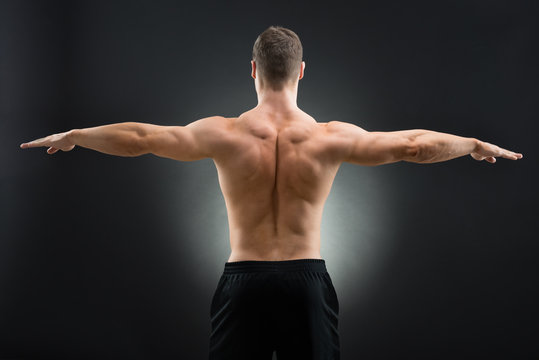 3,200+ Muscular Man With Arms Outstretched Stock Photos, Pictures &  Royalty-Free Images - iStock