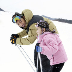 Father And Daughter Skiing