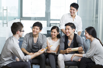 Young office workers holding a meeting