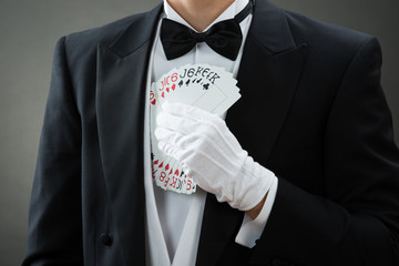 Magician Putting Fanned Out Cards In Suit
