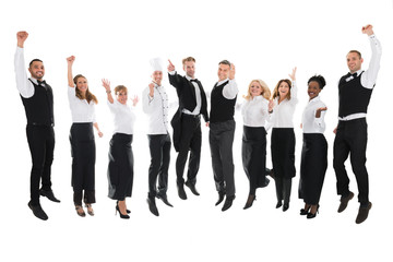 Fototapeta na wymiar Portrait Of Happy Restaurant Staff Celebrating Success