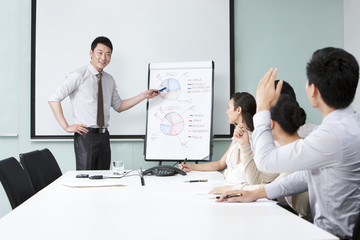 Young Businessman Asking Executive Question