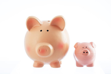 Two piggy bank toys isolated on a white background