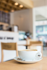 Hot art Latte Coffee in a cup on wooden table