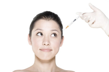 Young woman receiving Botox treatment