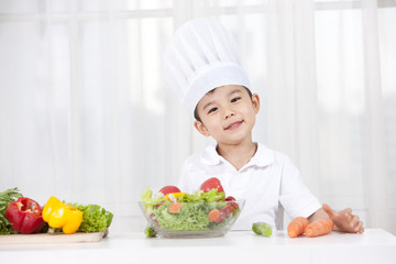 Young boy playing cooking
