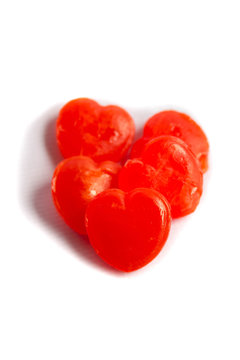 red heart candy isolated on white background © naiyanab
