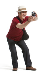 Portrait of senior man holding a camera