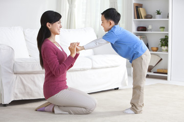 Chinese mother playing with son