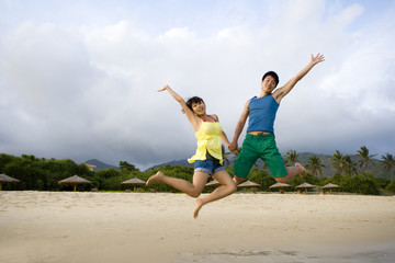 Young couple having fun at the beach