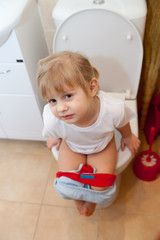  Little baby pissing on   toilet